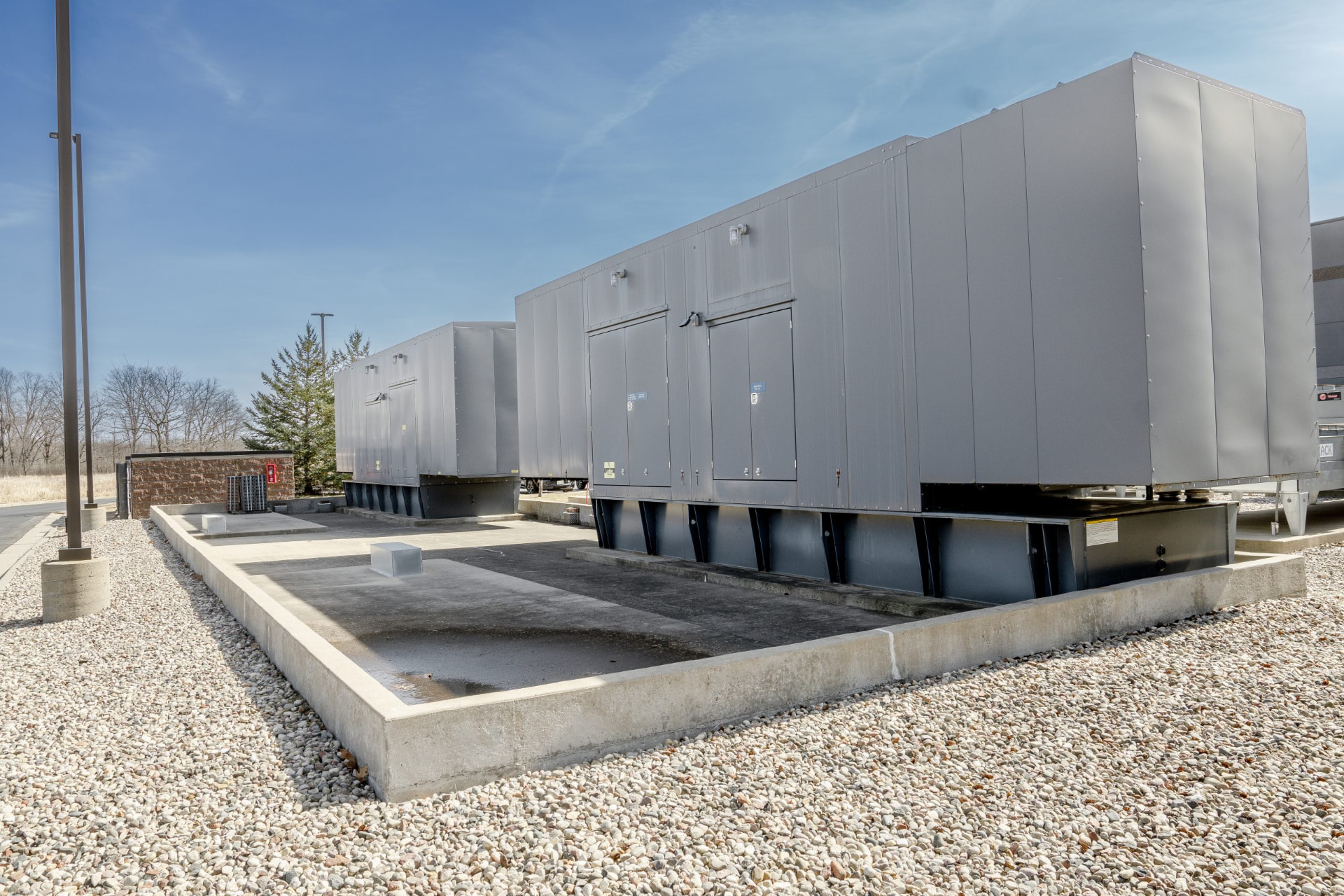 Rooftop power and cooling equipment on concrete pads